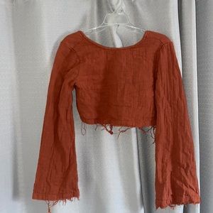 Free people rust colored crop top.